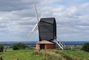 Windmill on a hill in open countryside
