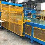 Auto Bundle Stacker for a corrugator conveyor.